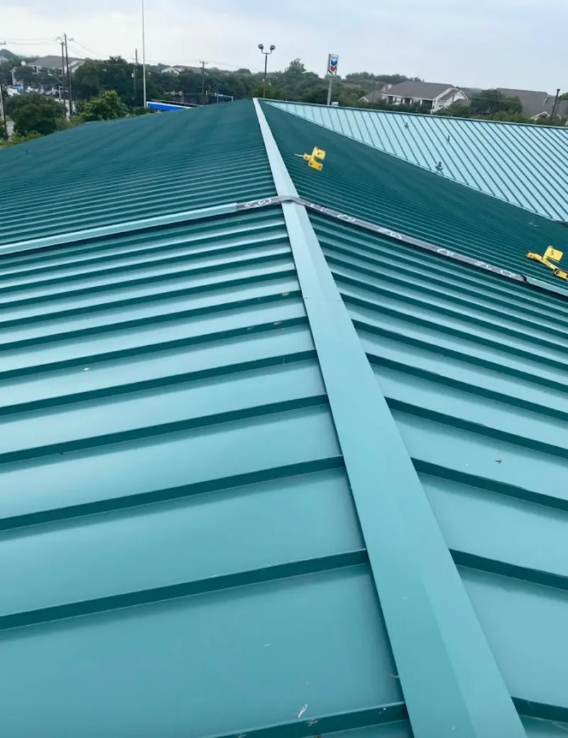 Green commercial metal roof ridge and valley for Metal Roof Repair in Rochester