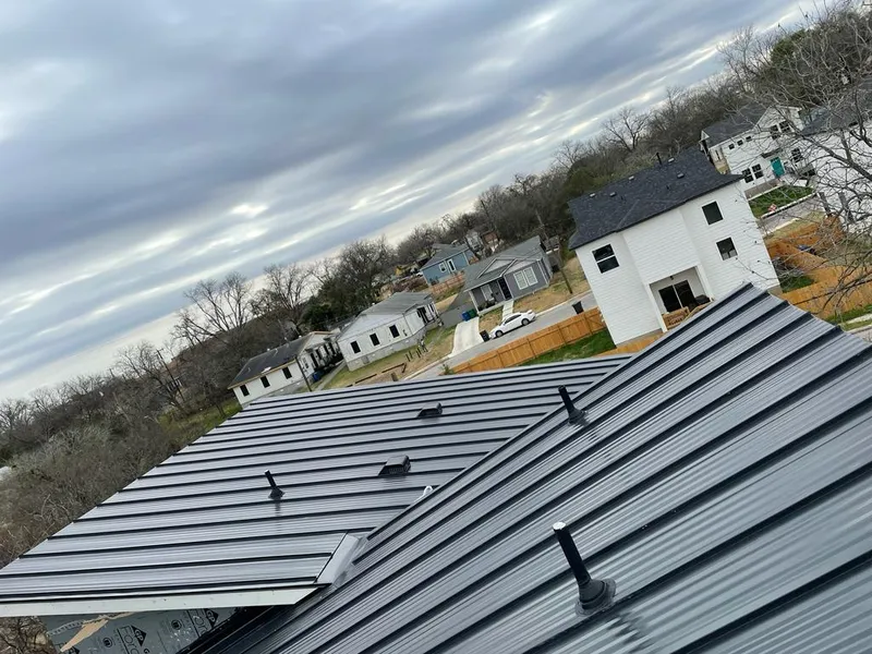 Standing seam metal roof panels with vents for Skylight Repair in Rochester